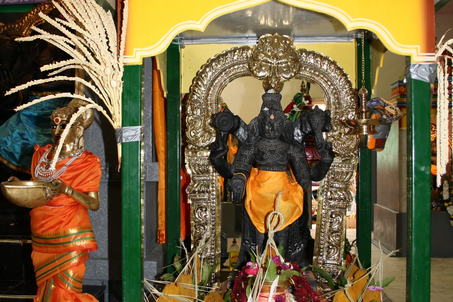 The same shrine from the hall, the pandal overhead.